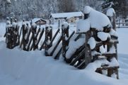 A fence covered by snow