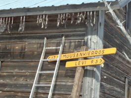 Signs on the wooden wall guiding directions in Levi